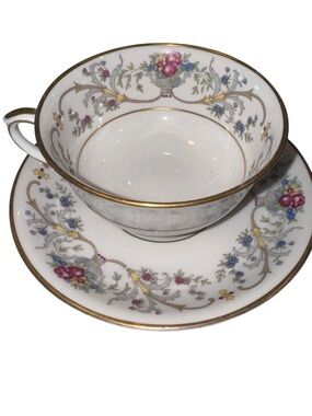 Fine Porcelain Teacup and Saucer Set with Pink Floral Motif and Gold Trim